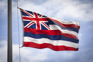Hawaiian state flag in the wind on Oahu Hawaii USA
