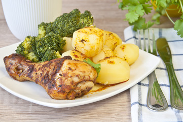 roast chicken with potatoes and broccoli