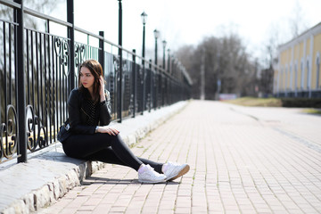 Girl on a walk through the spring city