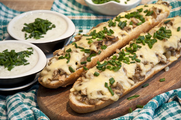 casserole with cheese and mushrooms sprinkled with fresh chive