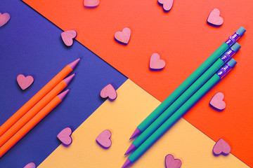 A mock-up of images of stationery. September 1, back to school. Background - texture of colored paper. Place for text. Selective focus, copy space, top view, flat lying.