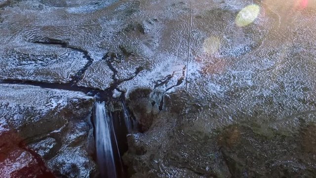 Bird's eye aerial static shot over Icelandic Waterfall Wide aerial shot flying towards and over Icelandic Waterfall Glj&radic;&int;frab&radic;&int;i