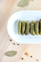 pickled cucumber gherkins on light background
