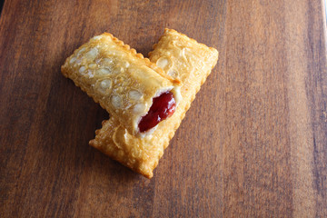 cherry pie Oil fried wild berries jam on a wooden background