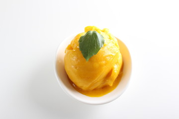 Fototapeta na wymiar yellow mango sorbet on a white background