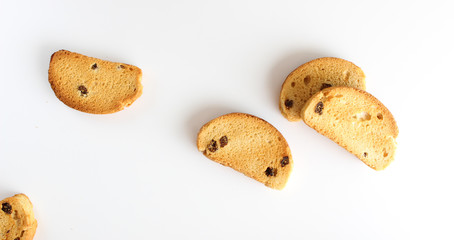 hardtack biscuits with raisins on white background