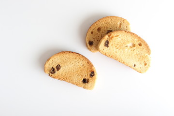 hardtack biscuits with raisins on white background