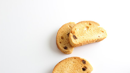 hardtack biscuits with raisins on white background