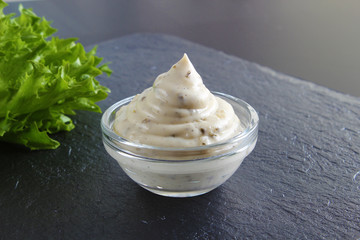 mayonnaise sauce, sour cream on a stone background