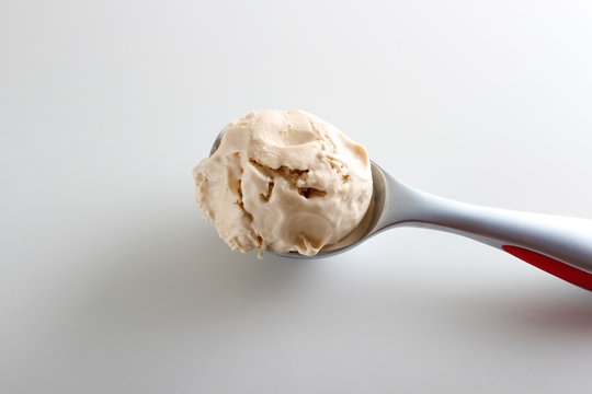 Ice Cream Ball Spoon On A White Background