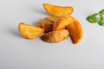 country slices potatoes on white background
