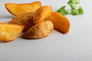 country slices potatoes on white background