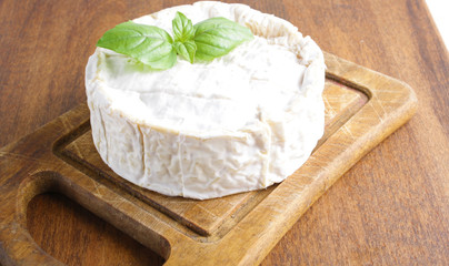 cheese brie on a wooden board