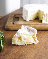 Camembert brie cheese on a wooden background