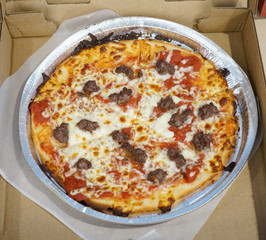   high angle view on fresh baked pizza in the box