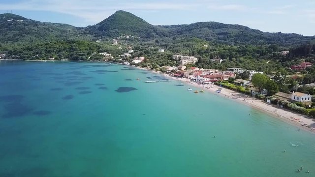 Greece, Corfu Island, drone footage of Messonghi Beach, Moraitika. Flying forward and making a left turn.