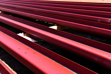  Steel building material ready for installation at commercial building site.