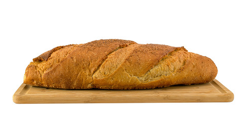 Brown bread on wooden board isolated on white