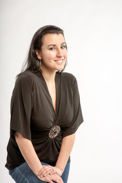 40 Something Brunette Woman In The Studio With A White Background