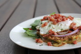 Zucchini and Sweet Potato Fritters with fried egg, bacon and salad, gourmet