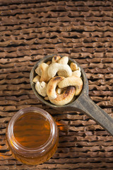 Walnuts and cashew oil on the table - Anacardium occidentale