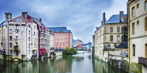 Colorful. historic waterfront buildings on Moselle River, Metz, France