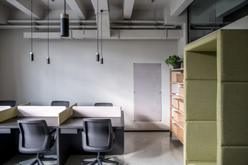 Fototapeta na wymiar Stylish office in loft style with gray walls