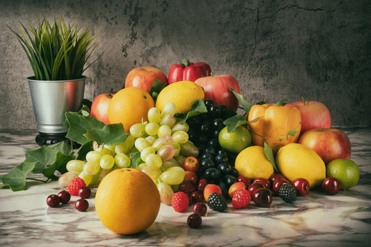 Still life of variery of fruits, oranges, grapes, strawberry, apples berries, cherry, lime and lemons on marble floor in vintage tone
