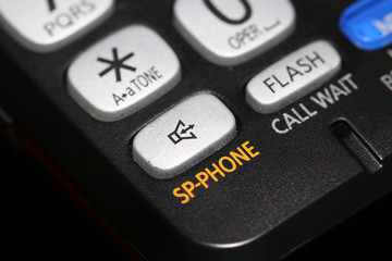 Fototapeta premium Speaker phone button close up shot