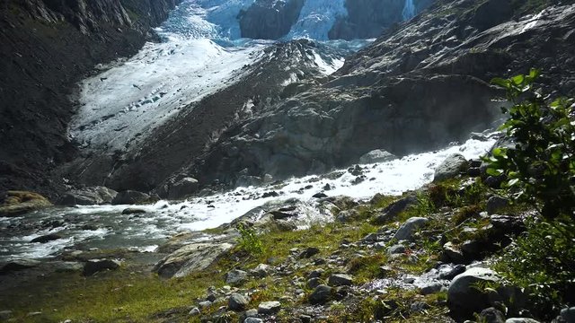 Wide angle with river coming down from glacier Folgefonna in Norway.