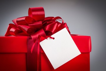Present wrapped with a bow and gift tag on it