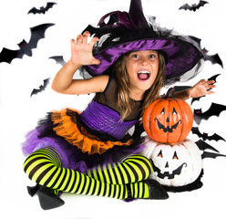Halloween kids, Happy scary girl dressed up in halloween costume of witch, sorcerer for pumpkin patch and halloween party