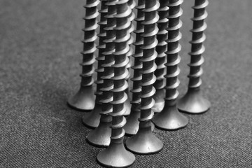 Close up shot of screws set up up side down