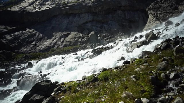 Fresh water in the river going down from Norwegian glacier Folgefonna.