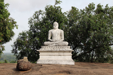 A Buddha statue on the way to the top of Pidurangala Rock to see Sigiriya