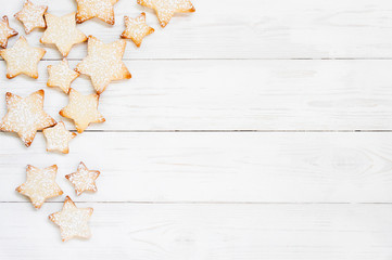 White wooden background with cookies - stars