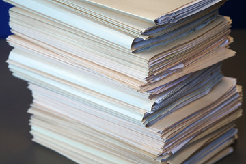 close up on the stacking documents and folders
