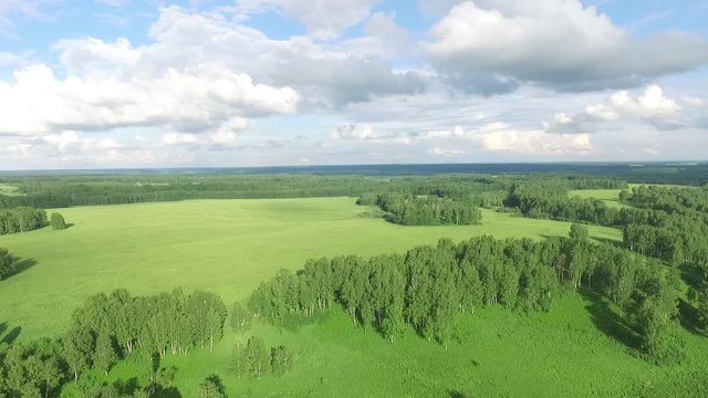 flying over the green field