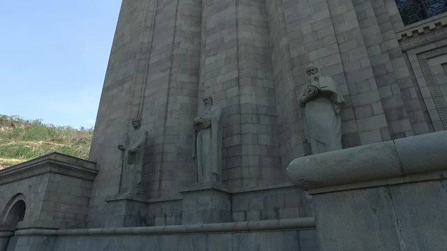 Tracking shot over some statues which are part of the Mesrop Mashtots Institute of Ancient Manuscripts known as Matenadaran.