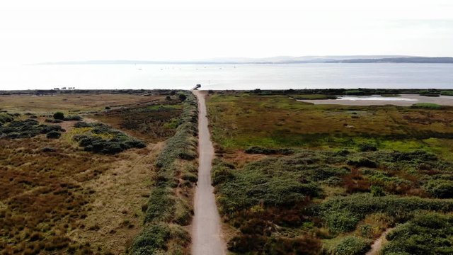 Aerial shot over the marshland along the Lymington foreshore in Hampshire