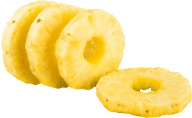 Ripe tropical pineapple slices on white background