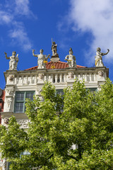 Fototapeta na wymiar 17th century Golden House at Long Market street, figures at the top Gdansk, Poland.