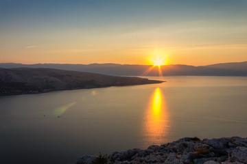 Fototapeta na wymiar Nice sunset on sea with mountain, island Krk Croatia