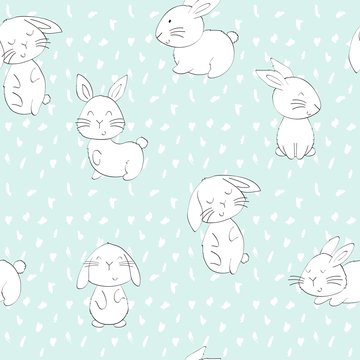 Vector seamless pattern with cartoon cute bunnies © Tapilipa