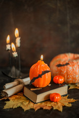 Postcard, Halloween background: pumpkins, candles, bats on dark background