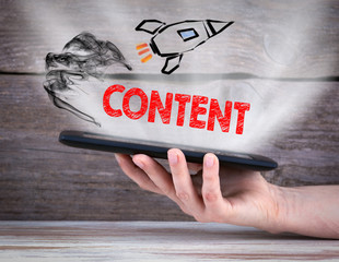 content and social media. Chart with keywords and icons. Tablet computer in the hand © STOATPHOTO