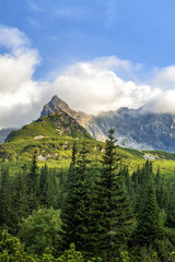 Obraz premium Polish Tatra mountains summer landscape with blue sky and white clouds. HDR image