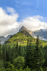 Fototapeta premium Polish Tatra mountains summer landscape with blue sky and white clouds. HDR image