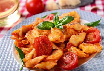 Traditional italian dish - tortellini with tomato sauce