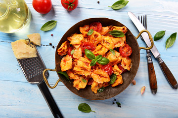 Traditional italian dish - tortellini with tomato sauce